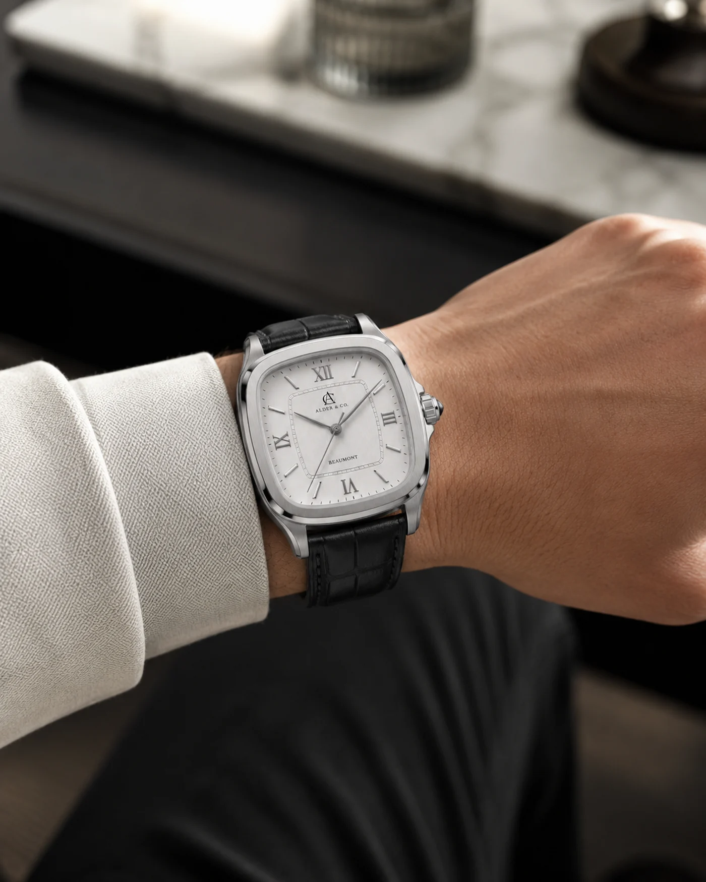 The Beaumont worn on the wrist, soft interior background